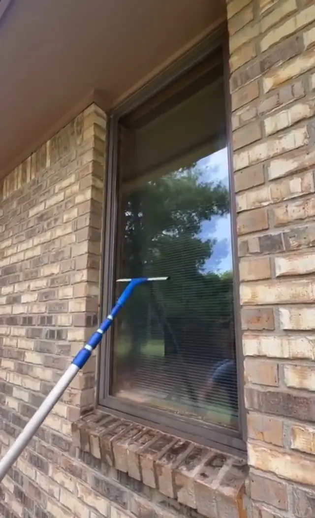 Pole-fed window cleaning on a brick home in Kokomo